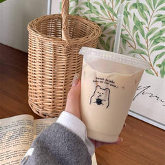 Kawaii plastic water bottle with straw lid.